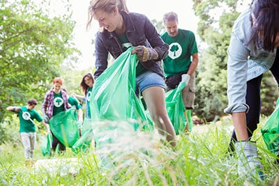 Group of people volunteering to clean litter.